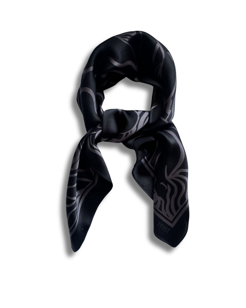 Black patterned silk scarf on a white background